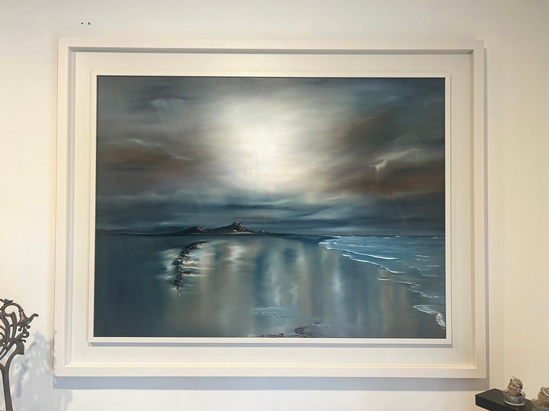 Moody Irish beach scene with sunlight breaking through clouds, painted by Marie McInerney.
