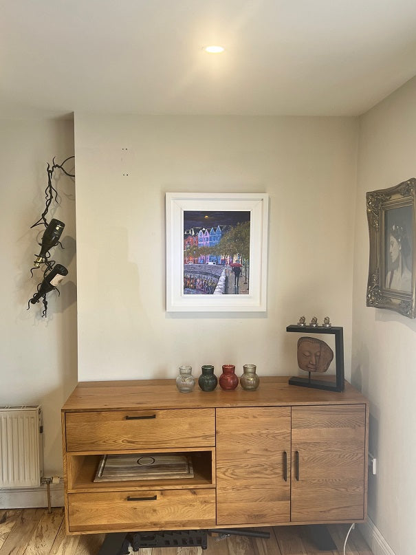 A Limited Edition Irish Cork City print from the Impression series, featuring Popes Quay and River Lee reflections in a light rain. Vibrant, atmospheric, and full of charm hanging on wall